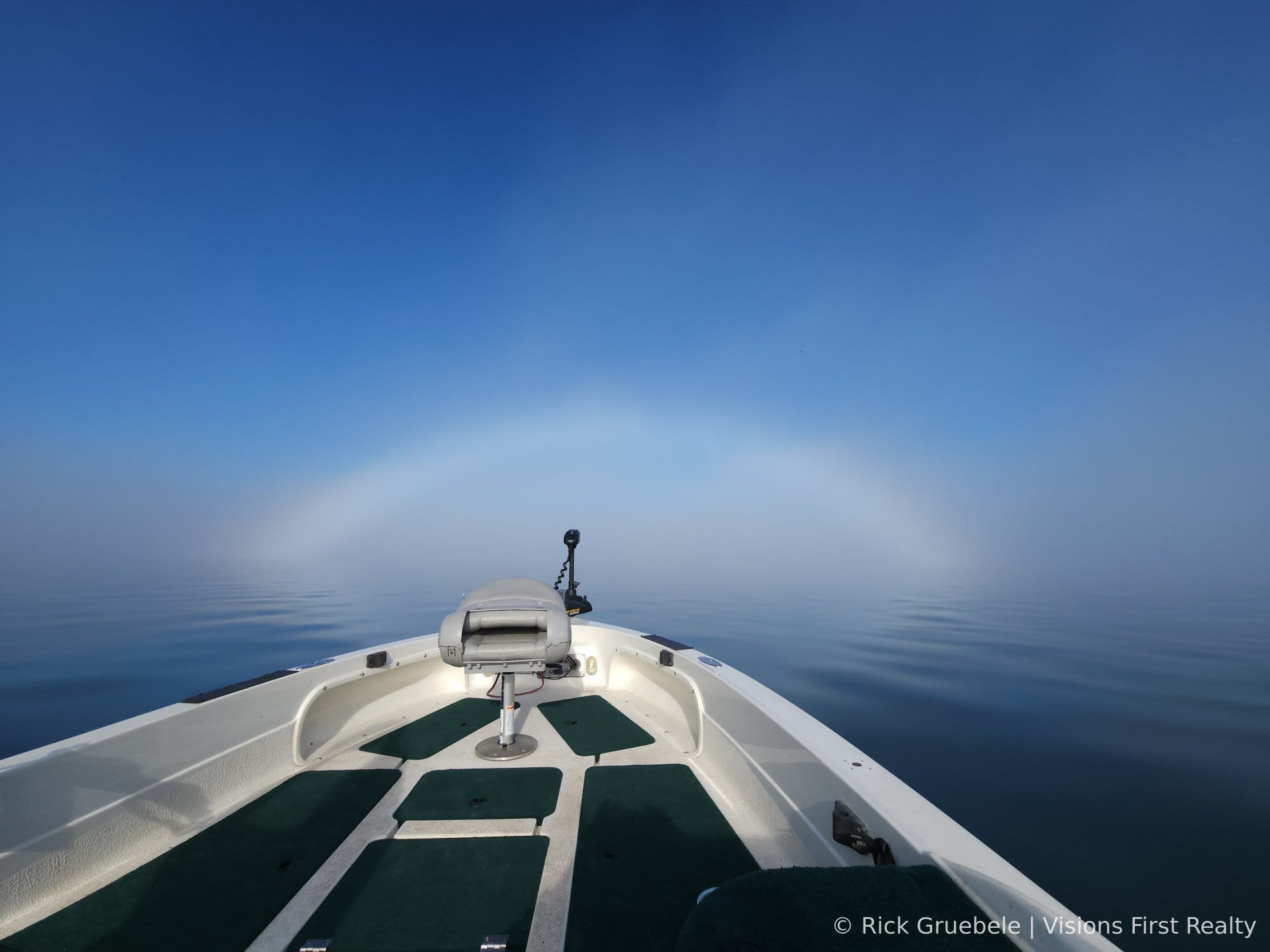 Fog bow arching over Chequamegon Bay viewed from boat bow, Houghton Point, Washburn WI — © Rick Gruebele | Visions First Realty