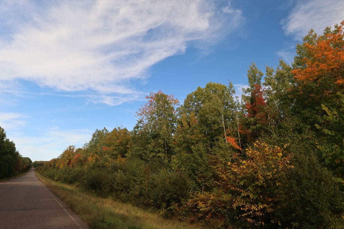 Paved W Old County Hwy K running along the wooded frontage of the South 20 acres, Town of Russell, WI